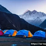 Home 22 네팔 산악 구조 시스템 - A high-altitude mountain rescue operation base in Nepal at Lukla during dawn, featuring a rugged sto...